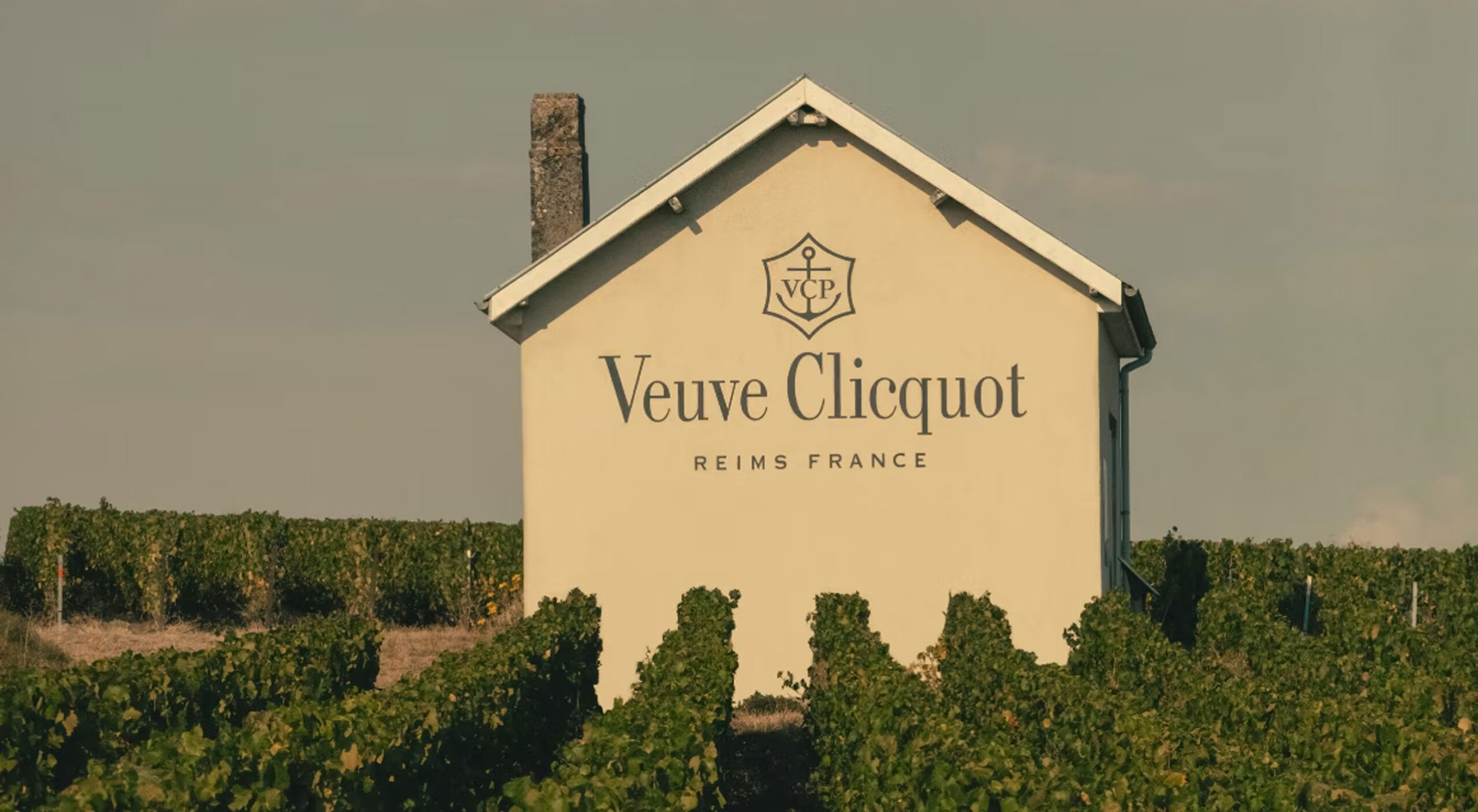 Veuve Clicquot Reims France written on a small house in a vineyard.