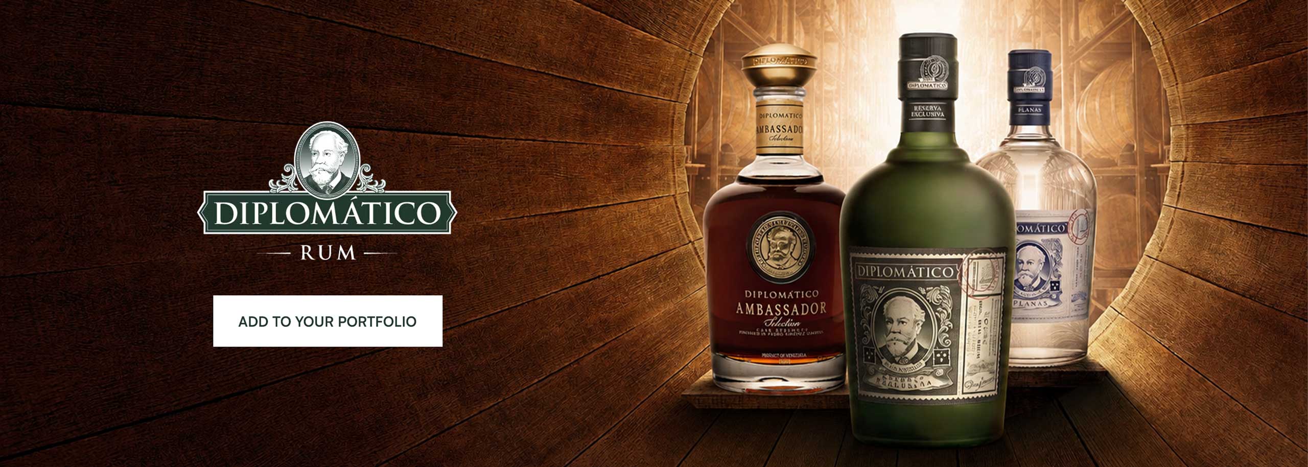 3 bottles of Rum Diplomatico on a wooden background